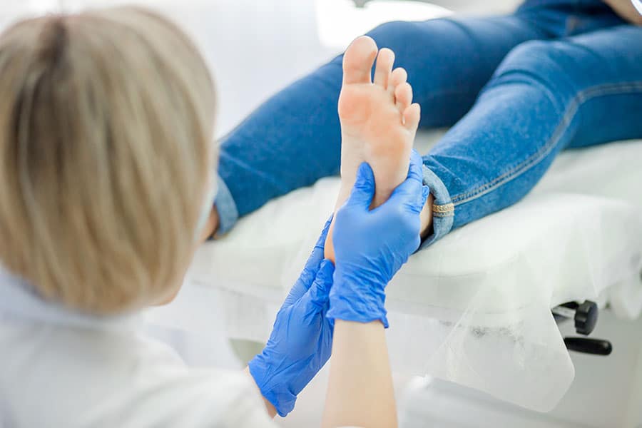 doctor examining foot bones